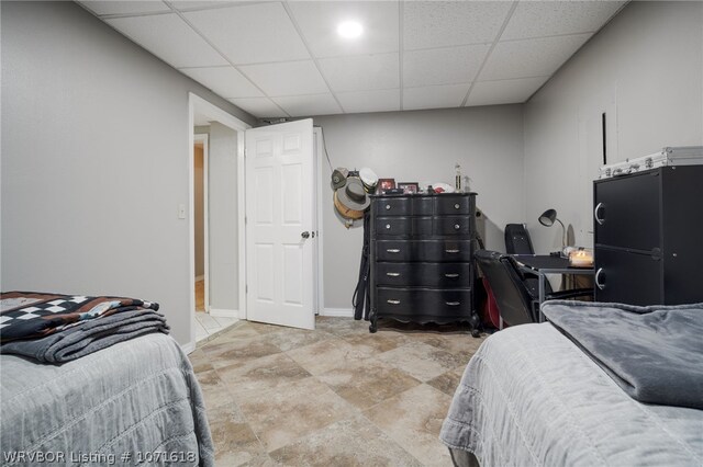 bedroom with a paneled ceiling