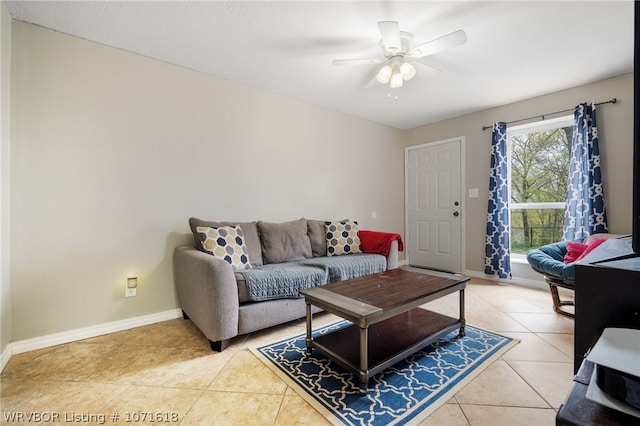 living room featuring ceiling fan and light tile patterned floors