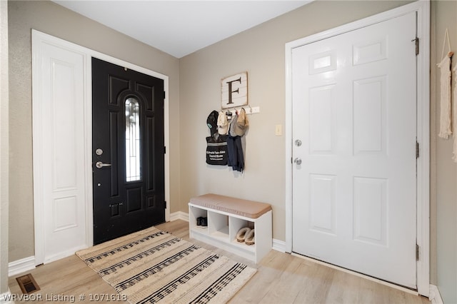 entryway with light hardwood / wood-style floors