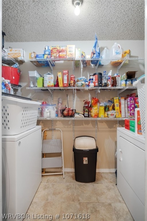 laundry room featuring separate washer and dryer