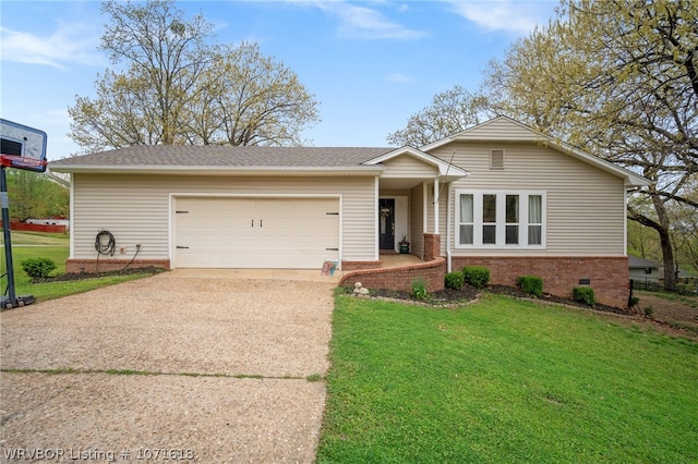 view of front of house featuring a garage and a front yard