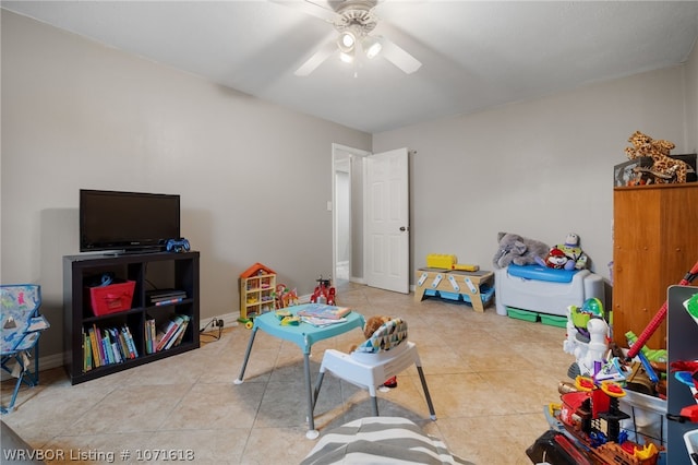 game room with light tile patterned floors and ceiling fan