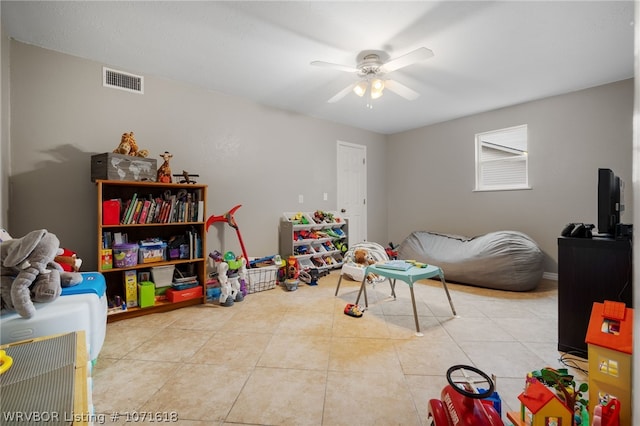 recreation room featuring ceiling fan and light tile patterned floors