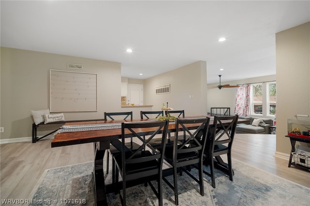 dining area featuring ceiling fan and light hardwood / wood-style floors