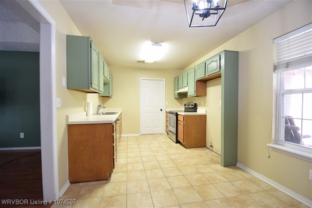 kitchen featuring sink, stainless steel electric range oven, and light tile patterned flooring