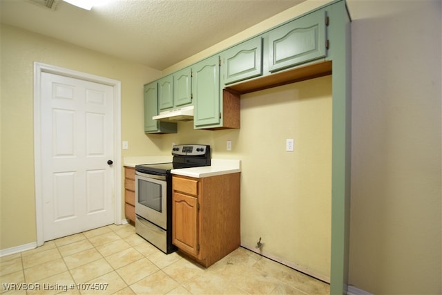 kitchen featuring a textured ceiling, green cabinets, and stainless steel range with electric cooktop