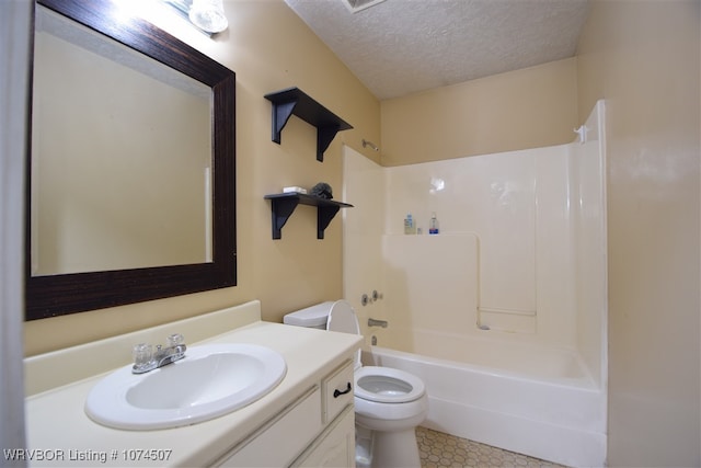 full bathroom featuring shower / tub combination, vanity, a textured ceiling, and toilet