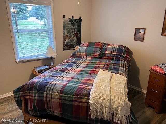 bedroom with hardwood / wood-style flooring