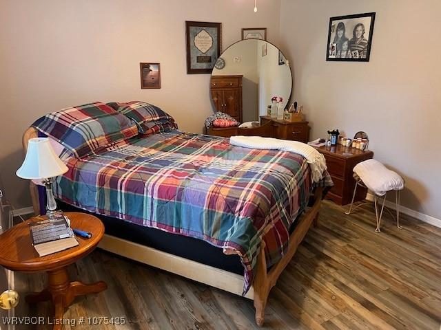 bedroom featuring dark hardwood / wood-style floors