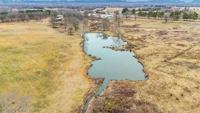 birds eye view of property featuring a water view and a rural view