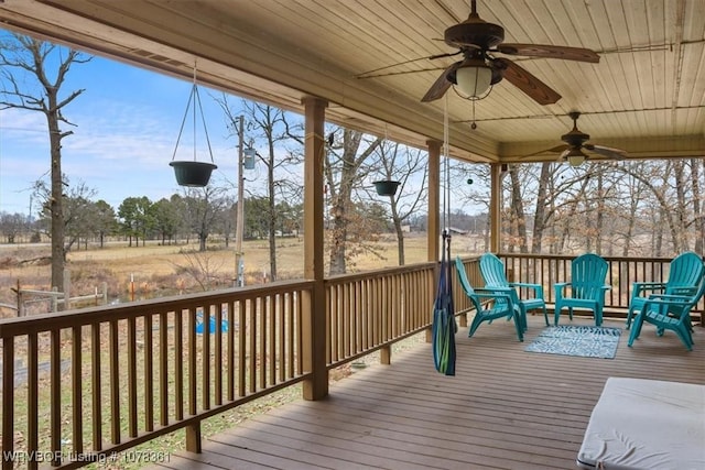 wooden deck featuring ceiling fan