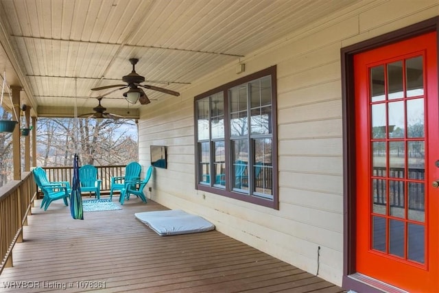 wooden deck featuring ceiling fan and a porch