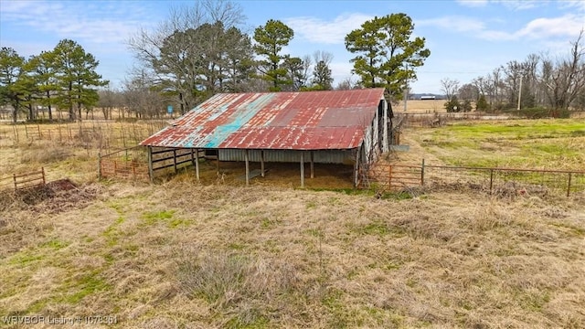 view of outdoor structure with a rural view