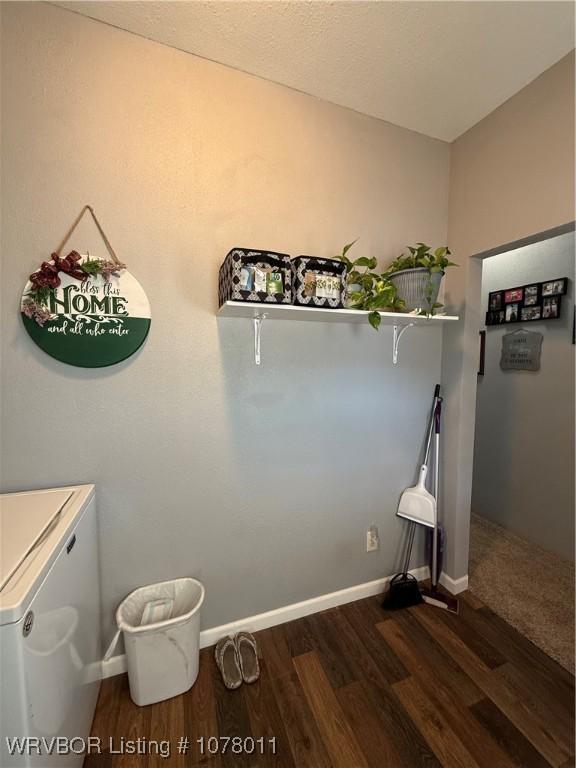 laundry room with dark hardwood / wood-style flooring and separate washer and dryer