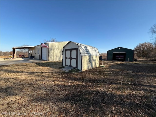 view of outbuilding with a garage and a carport