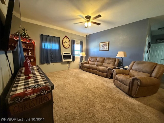 carpeted living room featuring heating unit and ceiling fan