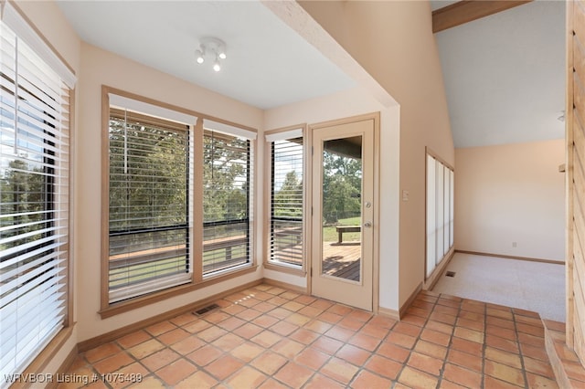 doorway with light tile patterned floors