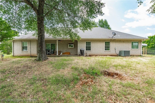 108498 4566th Rd, Sallisaw, OK 74955 - rear view of property featuring brick siding and a yard