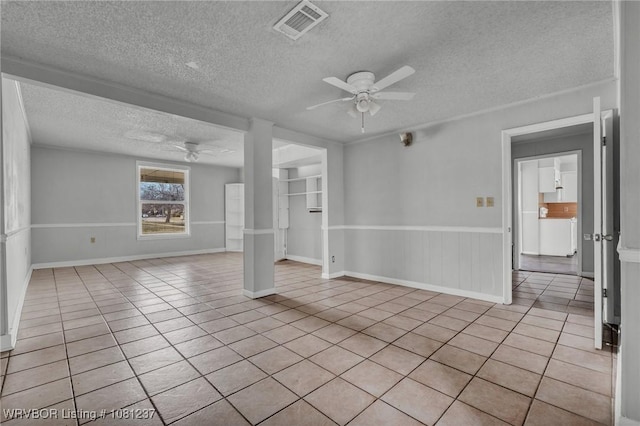 2101 N I St, Fort Smith, AR 72901 - spare room with a ceiling fan, light tile patterned floors, and a textured ceiling