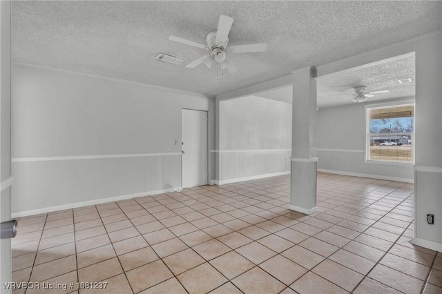 2101 N I St, Fort Smith, AR 72901 - tiled spare room featuring ceiling fan and a textured ceiling