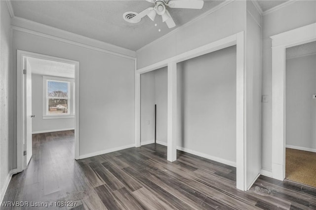 2101 N I St, Fort Smith, AR 72901 - unfurnished bedroom with ornamental molding, dark wood finished floors, ceiling fan, and baseboards