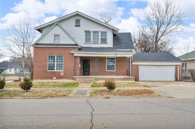 2101 N I St, Fort Smith, AR 72901 - traditional-style home with brick siding, covered porch, driveway, an attached garage, and a shingled roof