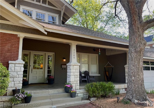 doorway to property with ceiling fan and covered porch