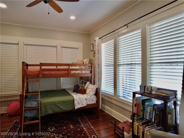 bedroom featuring ceiling fan, crown molding, and dark wood-type flooring