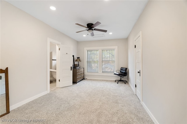 interior space featuring light colored carpet and ceiling fan