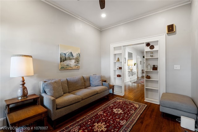 living room featuring dark hardwood / wood-style flooring, ceiling fan, built in features, and ornamental molding