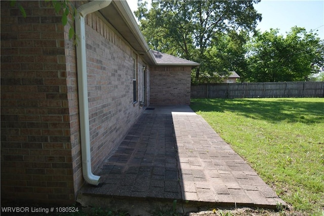 view of yard featuring a fenced backyard and a patio