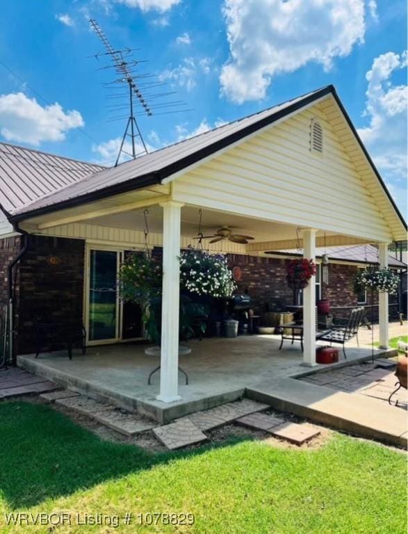 view of patio / terrace featuring ceiling fan