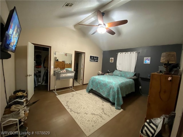 bedroom with hardwood / wood-style flooring, vaulted ceiling, and ceiling fan