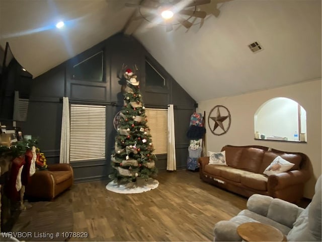 living room with vaulted ceiling and hardwood / wood-style floors