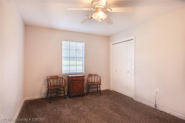 sitting room featuring baseboards, carpet flooring, and ceiling fan