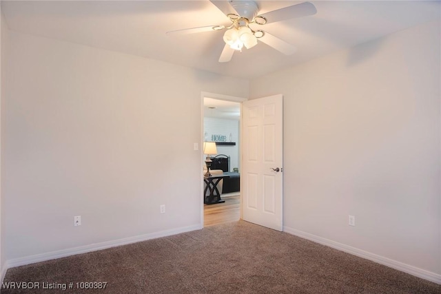 empty room with light carpet, baseboards, and ceiling fan