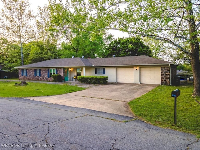 ranch-style home with driveway, a front lawn, brick siding, and a garage
