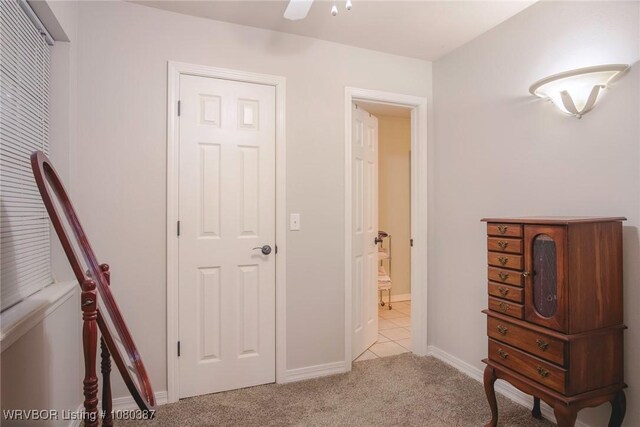 carpeted bedroom with baseboards and ceiling fan