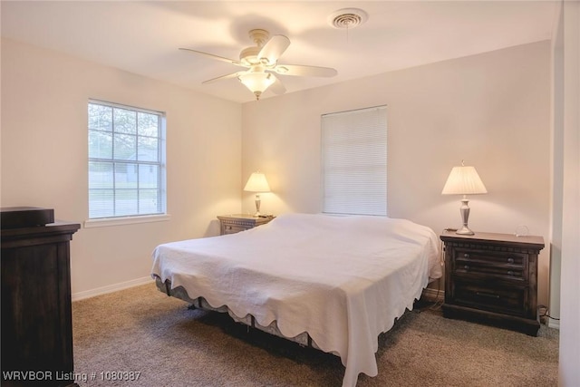 bedroom with ceiling fan, baseboards, carpet flooring, and visible vents