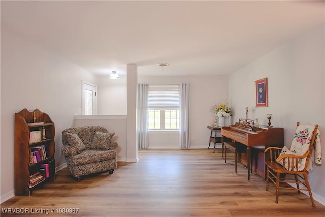 sitting room featuring wood finished floors and baseboards