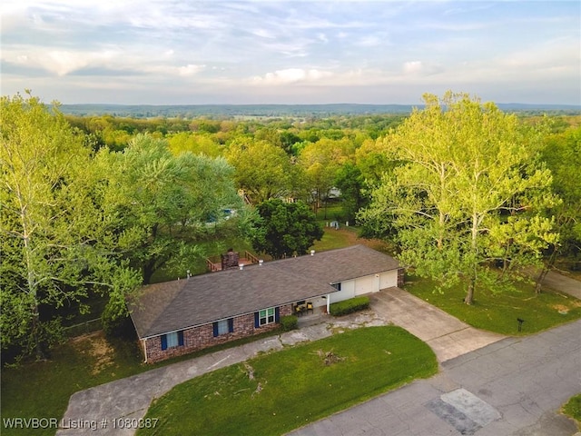 bird's eye view featuring a view of trees