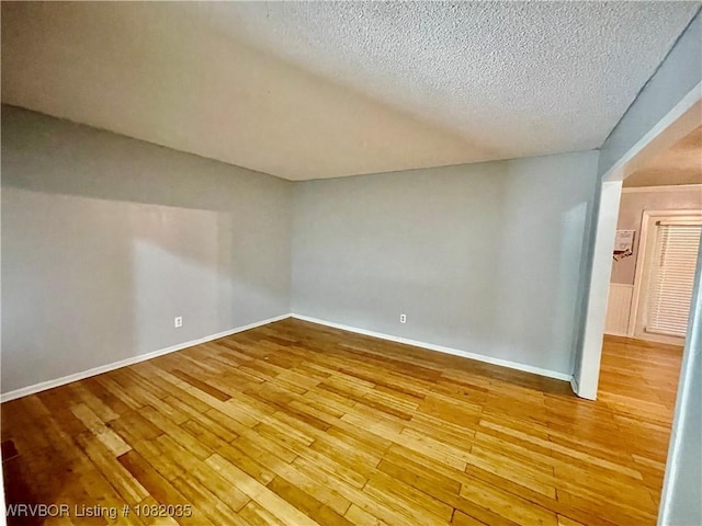 2119 55th Pl, Fort Smith, AR 72904 - spare room with a textured ceiling and wood finished floors