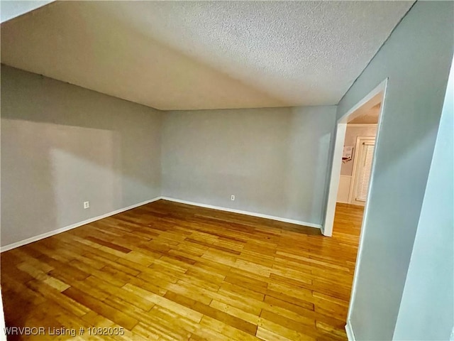 2119 55th Pl, Fort Smith, AR 72904 - additional living space featuring hardwood / wood-style flooring and a textured ceiling