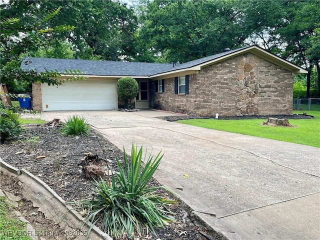 2119 55th Pl, Fort Smith, AR 72904 - ranch-style house with brick siding, driveway, an attached garage, and a front lawn