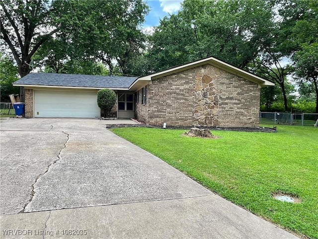 2119 55th Pl, Fort Smith, AR 72904 - view of front of home with concrete driveway, brick siding, and a garage