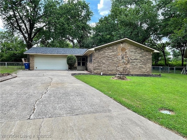 2119 55th Pl, Fort Smith, AR 72904 - view of front of house with concrete driveway, brick siding, and a garage
