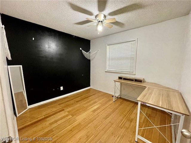 2119 55th Pl, Fort Smith, AR 72904 - spare room with a ceiling fan, light wood-style flooring, and a textured ceiling