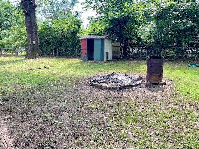 2119 55th Pl, Fort Smith, AR 72904 - fenced backyard with a shed and a fire pit