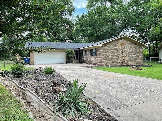 2119 55th Pl, Fort Smith, AR 72904 - ranch-style home with brick siding, an attached garage, driveway, and a front lawn