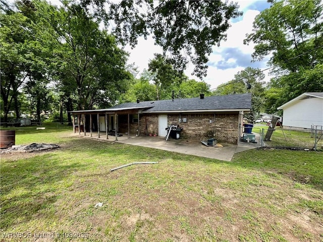 2119 55th Pl, Fort Smith, AR 72904 - back of house featuring a patio area and brick siding